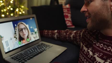 Adult-man-talking-by-video-conference-with-mum